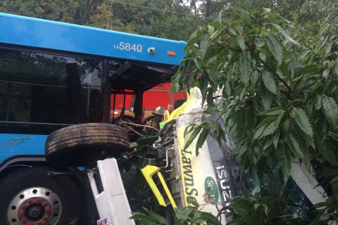 Ride On bus driver pinned in crash involving truck