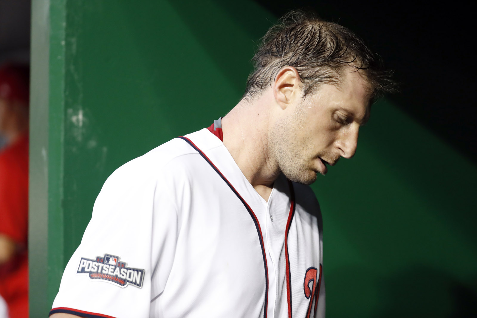 Washington Nationals starting pitcher Max Scherzer (31) walks out of the dugout after pitching the third inning of Game 1 of baseball's National League Division Series against the Los Angeles Dodgers, at Nationals Park, Friday, Oct. 7, 2016, in Washington. (AP Photo/Alex Brandon)