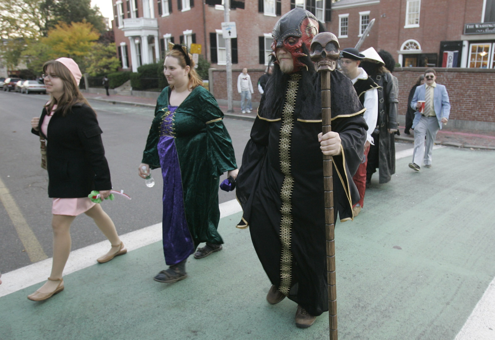 Dressed in a variety of costumes, a group crosses the street on Halloween in Salem, Mass., Wednesday Oct. 31, 2007. (AP Photo/Charles Krupa)