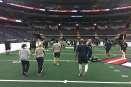 Competitors warm up during tryouts for the Washington Valor, D.C.’s new Arena Football League team. Tryouts were held at the Verizon Center on Saturday, Oct. 8, 2015. (WTOP/John Domen)