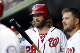 Washington Nationals left fielder Jayson Werth (28) checks his bat in the dugout during a baseball game against the New York Mets at Nationals Park, Wednesday, Sept. 14, 2016, in Washington. The Nationals won 1-0. (AP Photo/Alex Brandon)
