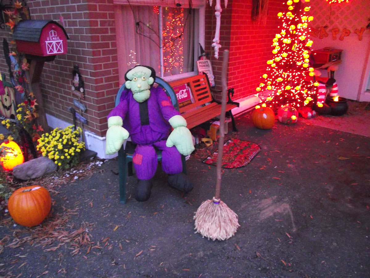 From Sue Rushkowski at her mom's house in Stratford Landing in Alexandria: "Frankenstein, a motion-activated dancing broom (freaks kids out), and a pumpkin tree. They have a fog machine over in the corner. We also have a witch on a swing in the tree. We have a string attached to the swing. When kids come up the long driveway (lined with bags w/candles in them) we start swinging the witch. Scares them pretty good…We have FUN!!!! (Sue Rushkowski)
