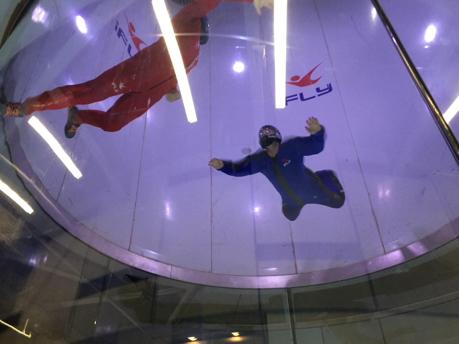 Andrew Einstein, an experienced sky diver, works on some new tricks at the Loudoun County iFly location. (WTOP/Noah Frank)