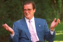 British actor Roger Moore gestures during an interview in the Studio City section of Los Angeles, April 22, 1996. (AP Photo/Chris Pizzello)