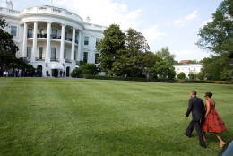 President Barack Obama and First Lady Michelle Obama walk from Marine One on the South Lawn upon arrival at the White House following a trip to California, June 16, 2014. (Official White House Photo by Pete Souza)

This official White House photograph is being made available only for publication by news organizations and/or for personal use printing by the subject(s) of the photograph. The photograph may not be manipulated in any way and may not be used in commercial or political materials, advertisements, emails, products, promotions that in any way suggests approval or endorsement of the President, the First Family, or the White House.