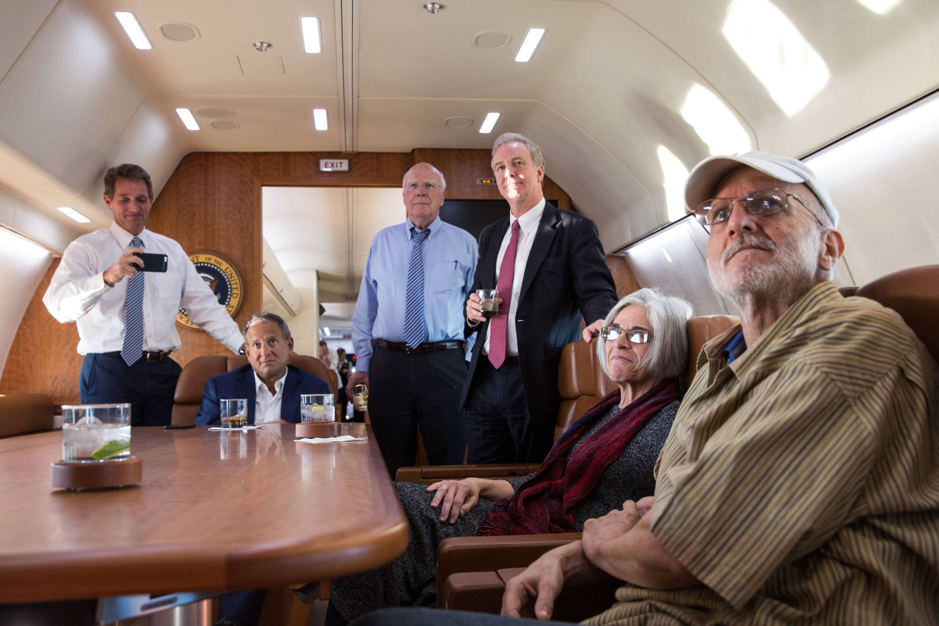 Alan Gross with his wife Judy, attorney Scott Gilbert, Rep. Chris Van Hollen, D-Md., Sen. Patrick Leahy, D-Vt., and Sen. Jeff Flake, R-Ariz. watch television onboard a government plane headed back to the US as the news breaks of his release, Dec. 17, 2014. (Official White House Photo by Lawrence Jackson)

This official White House photograph is being made available only for publication by news organizations and/or for personal use printing by the subject(s) of the photograph. The photograph may not be manipulated in any way and may not be used in commercial or political materials, advertisements, emails, products, promotions that in any way suggests approval or endorsement of the President, the First Family, or the White House.