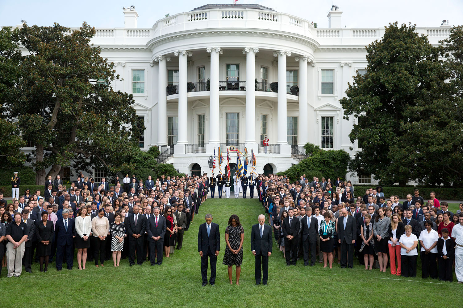 President Barack Obama, First Lady Michelle Obama and Vice President Joe Biden join White House staff on the South Lawn of the White House to observe a moment of silence marking the 13th anniversary of the 9/11 attacks, Sept. 11, 2014. (Official White House Photo by Chuck Kennedy)

This official White House photograph is being made available only for publication by news organizations and/or for personal use printing by the subject(s) of the photograph. The photograph may not be manipulated in any way and may not be used in commercial or political materials, advertisements, emails, products, promotions that in any way suggests approval or endorsement of the President, the First Family, or the White House.