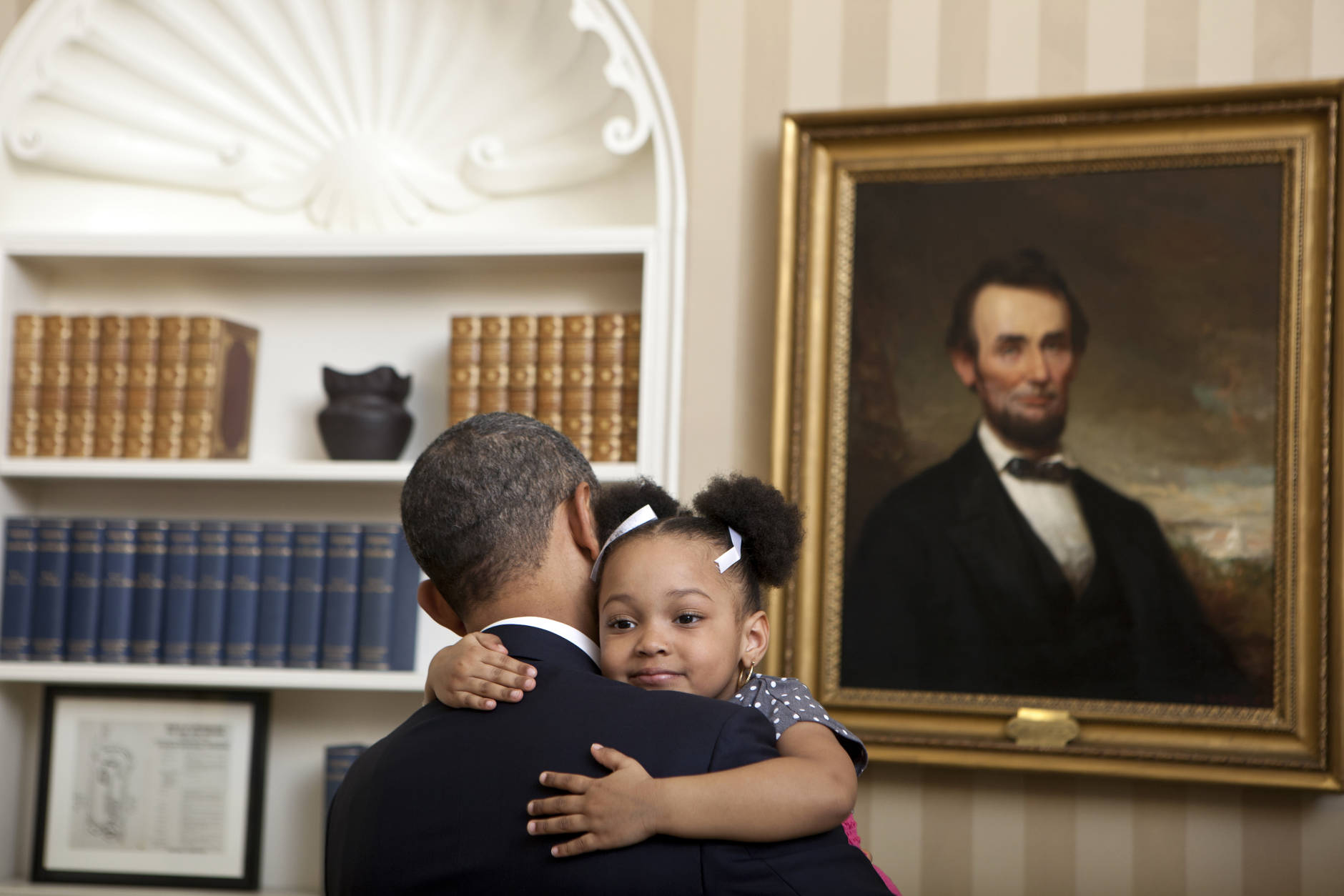 Feb. 1, 2012
"Lawrence Jackson captured this cute photograph of the President holding Arianna Holmes, 3, before taking a departure photo with members of her family in the Oval Office." 
(Official White House Photo by Lawrence Jackson) 

This official White House photograph is being made available only for publication by news organizations and/or for personal use printing by the subject(s) of the photograph. The photograph may not be manipulated in any way and may not be used in commercial or political materials, advertisements, emails, products, promotions that in any way suggests approval or endorsement of the President, the First Family, or the White House.