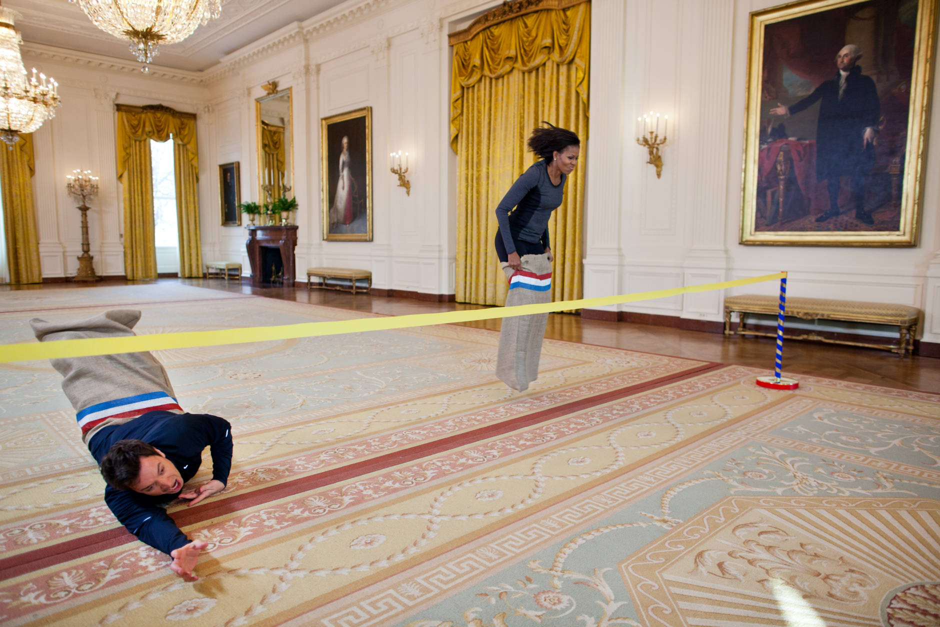 Jan. 25, 2012
"Chuck Kennedy made this amusing photograph of First Lady Michelle Obama participating in a potato sack race with Jimmy Fallon in the East Room of the White House during a ÒLate Night with Jimmy FallonÓ taping for the second anniversary of the "LetÕs Move!" initiative." 
(Official White House Photo by Chuck Kennedy)

This official White House photograph is being made available only for publication by news organizations and/or for personal use printing by the subject(s) of the photograph. The photograph may not be manipulated in any way and may not be used in commercial or political materials, advertisements, emails, products, promotions that in any way suggests approval or endorsement of the President, the First Family, or the White House.Ê