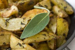 This Oct. 11, 2011 photo shows sage roasted potato wedges in Concord, N.H. Mashed potatoes are traditional, but roasted potatoes can be just as delicious.    (AP Photo/Matthew Mead)