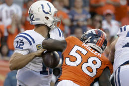 FILE - In this Sunday, Sept. 18, 2016, file photo, Denver Broncos outside linebacker Von Miller, right, forces a fumble by Indianapolis Colts quarterback Andrew Luck allowing linebacker Shane Ray score during the second half in a NFL football game in Denver. The Broncos' star pass rusher has four sacks already, including the game-sealing strip of Andrew Luck that was reminiscent of his mammoth hits in the Super Bowl when he snatched the football and the Lombardi Trophy from Cam Newton's grasp.  (AP Photo/Jack Dempsey, File)