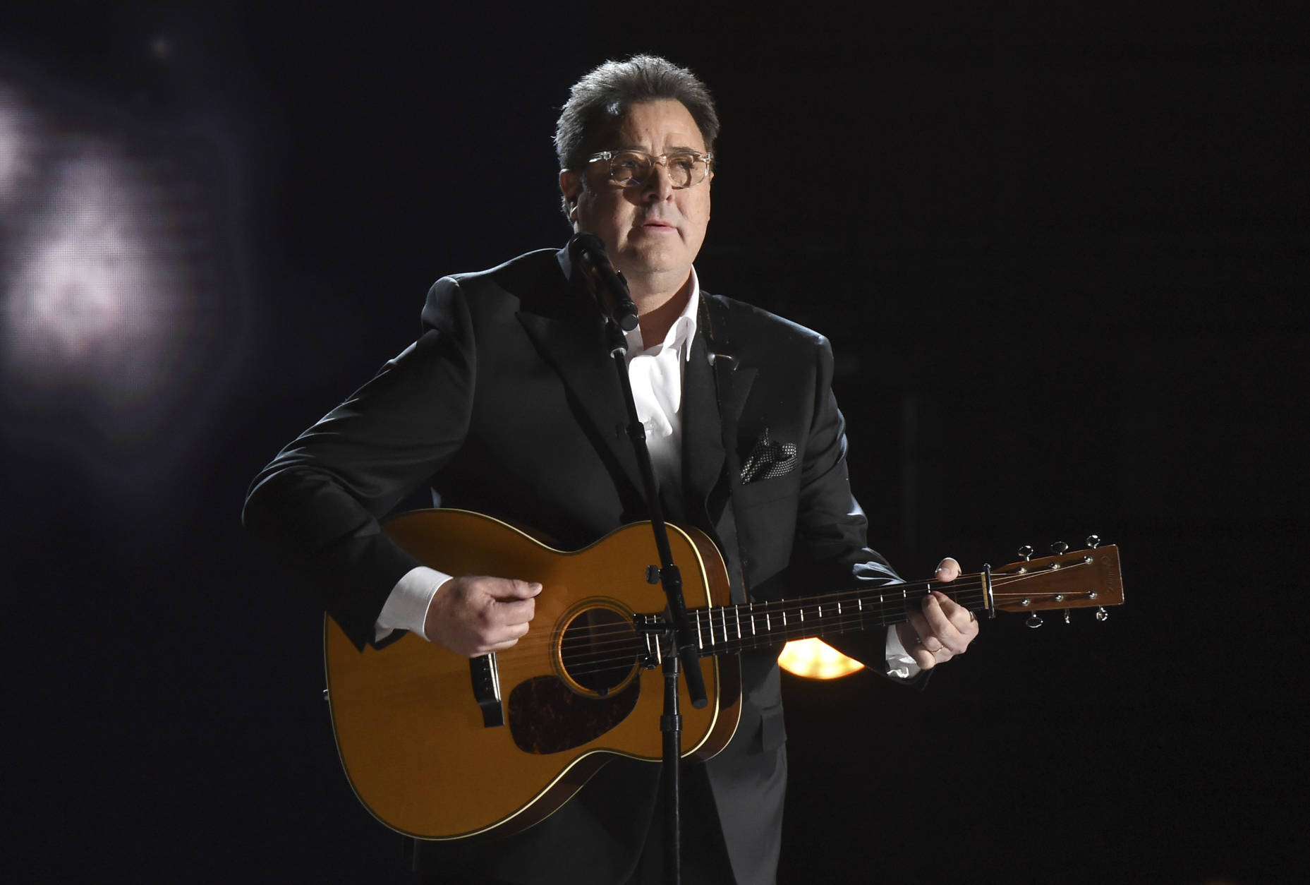 Vince Gill performs "Mama Tried" at the 50th annual CMA Awards at the Bridgestone Arena on Wednesday, Nov. 2, 2016, in Nashville, Tenn. (Photo by Charles Sykes/Invision/AP)