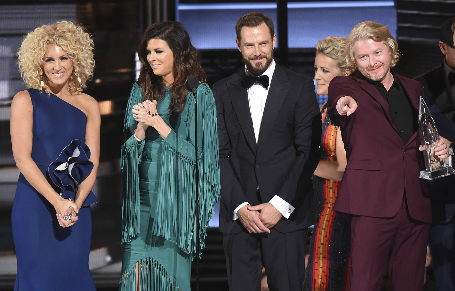 Little Big Town, from left, Kimberly Schlapman, Karen Fairchild, Jimi Westbrook, and Phillip Sweet accept the award for vocal group of the year at the 50th annual CMA Awards at the Bridgestone Arena on Wednesday, Nov. 2, 2016, in Nashville, Tenn. (Photo by Charles Sykes/Invision/AP)