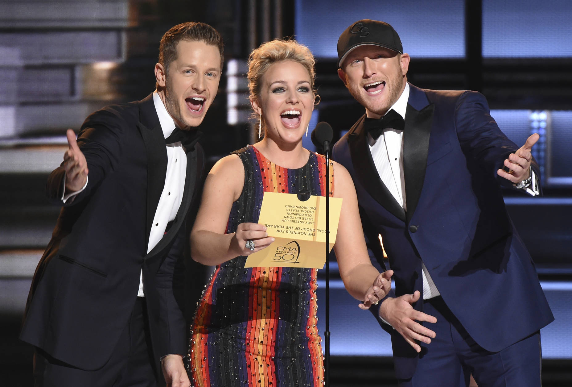 Josh Dallas, from left, Cam and Cole Swindell present the award for vocal group of the year at the 50th annual CMA Awards at the Bridgestone Arena on Wednesday, Nov. 2, 2016, in Nashville, Tenn. (Photo by Charles Sykes/Invision/AP)