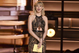 Taylor Swift presents the award for entertainer of the year at the 50th annual CMA Awards at the Bridgestone Arena on Wednesday, Nov. 2, 2016, in Nashville, Tenn. (Photo by Charles Sykes/Invision/AP)