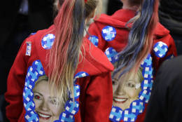 Girls wear jackets with the image of Hillary Clinton during Democratic presidential nominee's election night rally in the Jacob Javits Center glass enclosed lobby in New York, Tuesday, Nov. 8, 2016. (AP Photo/David Goldman)