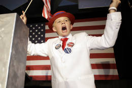 Dalton Walker, 13, cheers during Donald Trump's acceptance speech for President of the United States of America at the Colorado Republican election night party Tuesday, Nov. 8, 2016, in Greenwood Village, Colo. (AP Photo/Jack Dempsey)