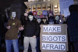 Protesters stand on the Mass. Statehouse steps in opposition of Donald Trump's presidential election victory in Boston, Wednesday evening, Nov. 9, 2016. (AP Photo/Charles Krupa)