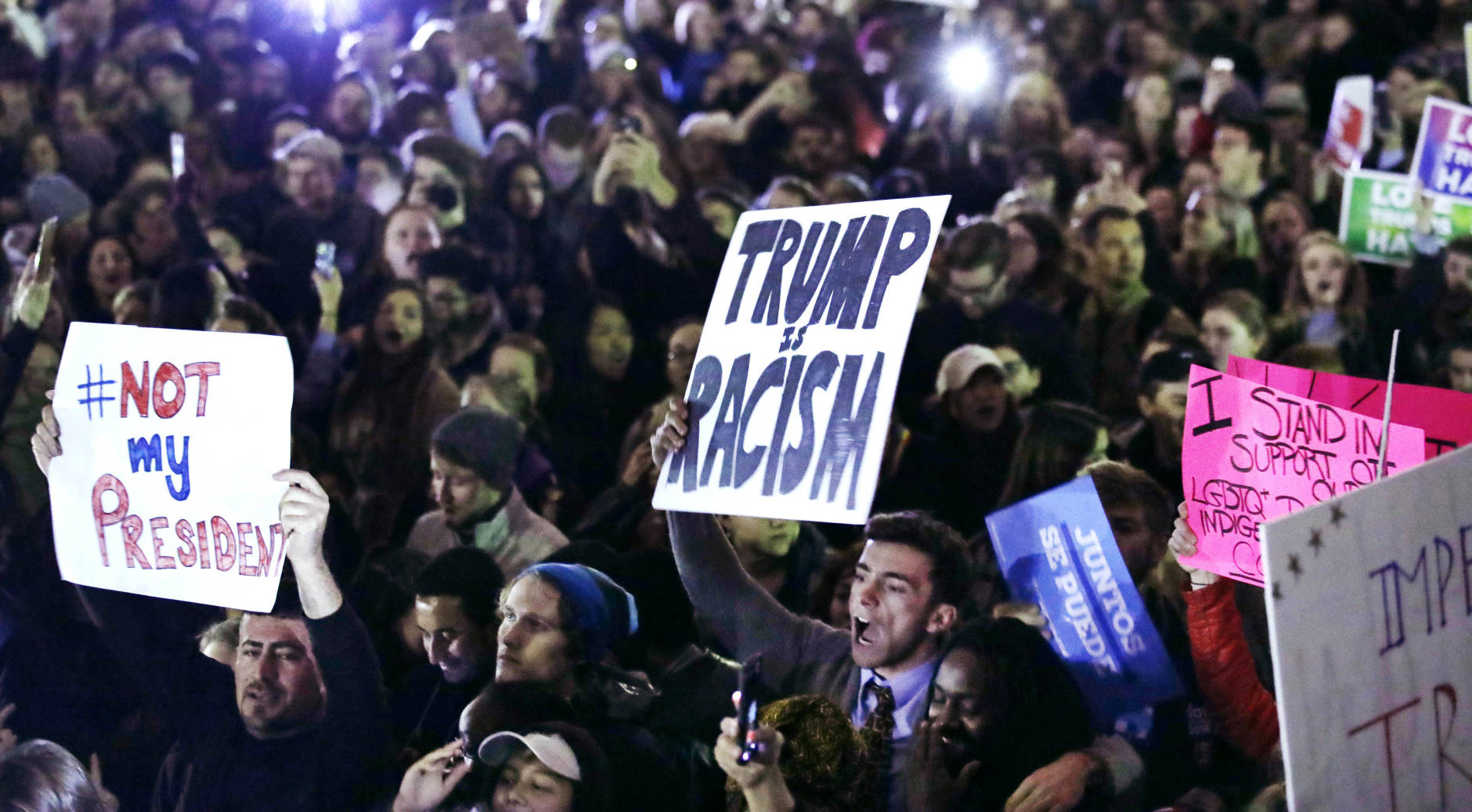 Hundreds protest in opposition of Donald Trump's presidential election victory on Boston Common in Boston, Wednesday evening, Nov. 9, 2016. (AP Photo/Charles Krupa)