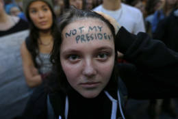 Clair Sheehan has the words "Not My President" written on her forehead as she takes part in a protest against the election of President-elect Donald Trump, Wednesday, Nov. 9, 2016, in downtown Seattle. (AP Photo/Ted S. Warren)
