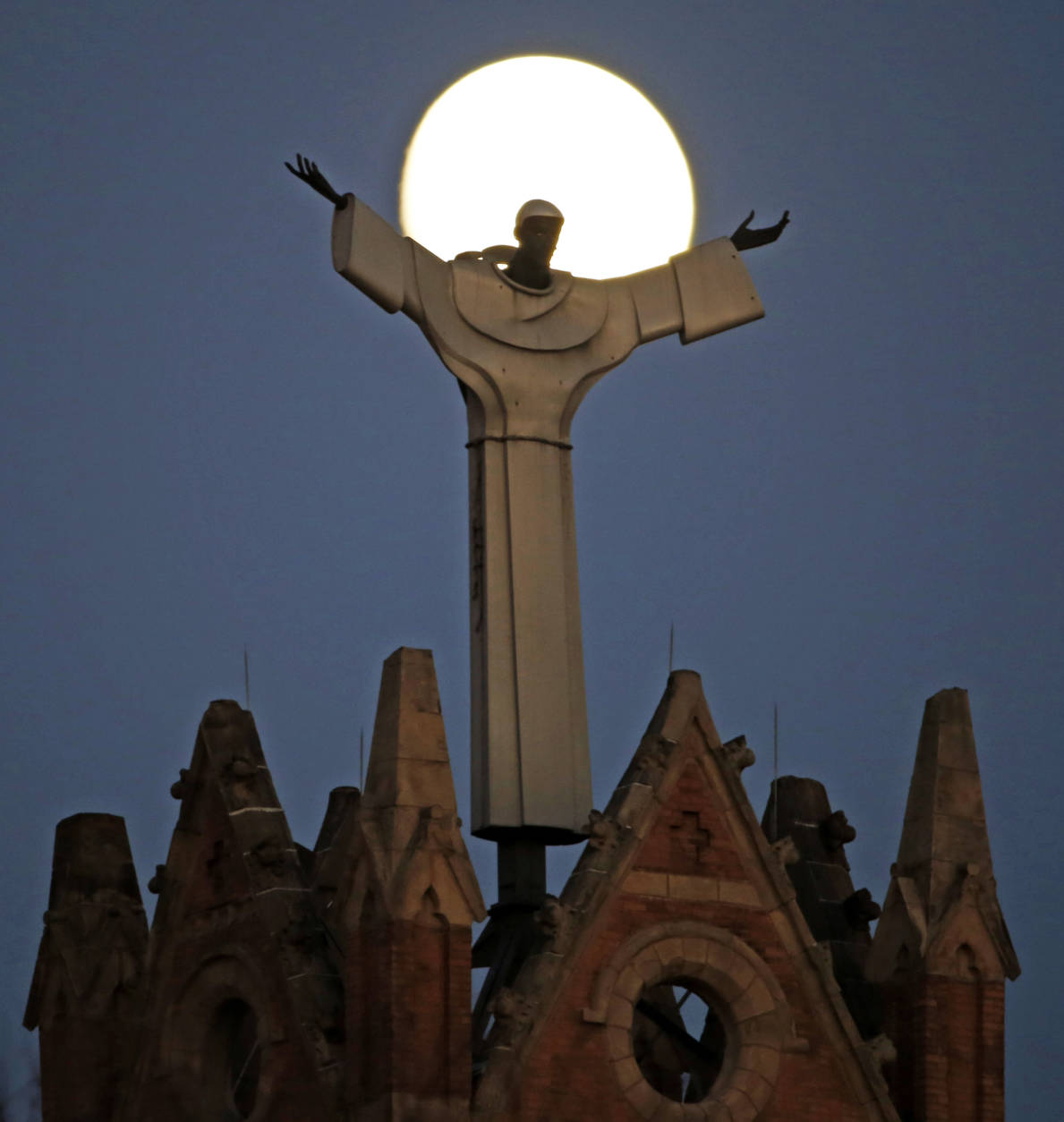 The moon rises behind St. Benedict The Moor Catholic church in Pittsburgh Saturday, Nov. 12, 2016. The Supermoon on November 14, 2016, will be the closest a Full Moon has been to Earth since January 26, 1948. The next time a Full Moon is even closer to Earth will be on November 25, 2034. (AP Photo/Gene J. Puskar)