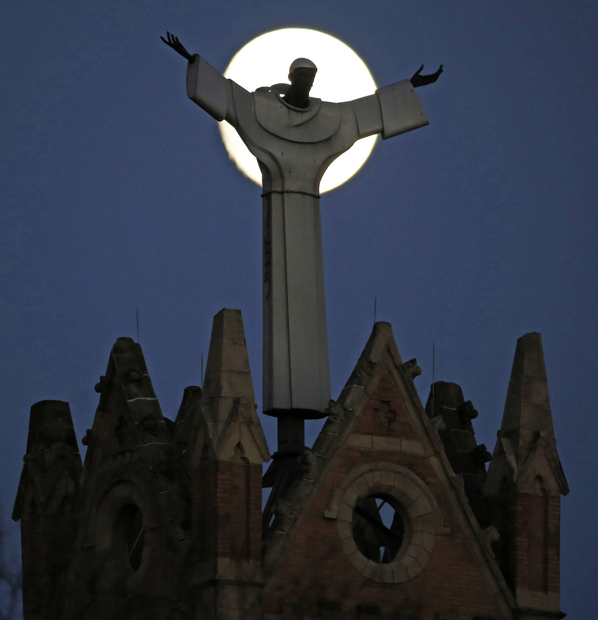 The moon rises behind St. Benedict The Moor Catholic church in Pittsburgh Saturday, Nov. 12, 2016. The Supermoon on November 14, 2016, will be the closest a Full Moon has been to Earth since January 26, 1948. The next time a Full Moon is even closer to Earth will be on November 25, 2034. (AP Photo/Gene J. Puskar)