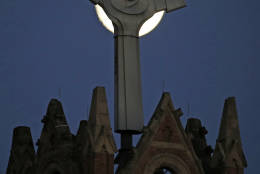 The moon rises behind St. Benedict The Moor Catholic church in Pittsburgh Saturday, Nov. 12, 2016. The Supermoon on November 14, 2016, will be the closest a Full Moon has been to Earth since January 26, 1948. The next time a Full Moon is even closer to Earth will be on November 25, 2034. (AP Photo/Gene J. Puskar)