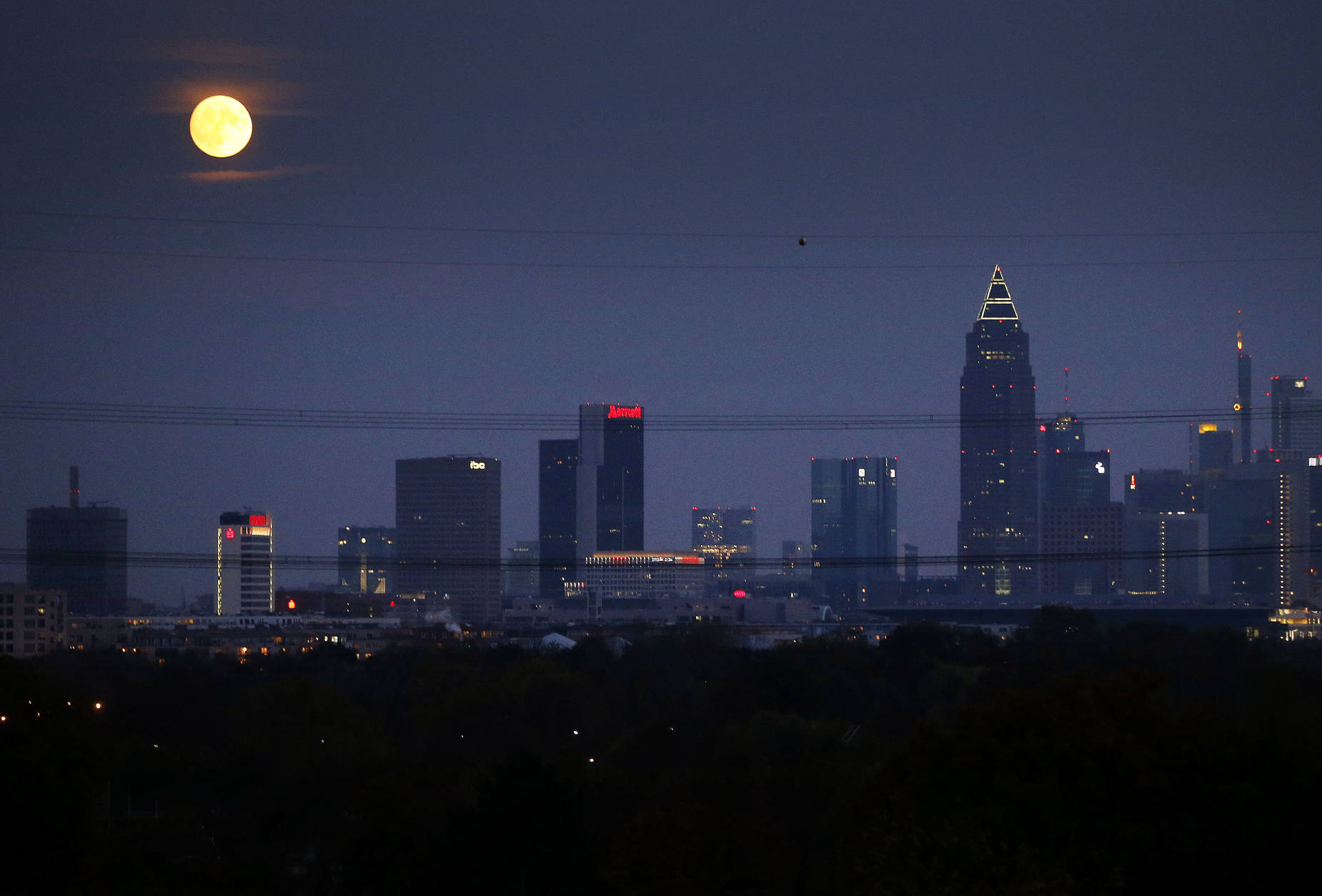 The moon rises over the banking district in Frankfurt, Germany, Sunday, Nov. 13, 2016. On Monday the so-called 'supermoon' will be the closest full moon to earth since 1948, and it won't be as close again until 2034. ﻿ ﻿﻿(AP Photo/Michael Probst)