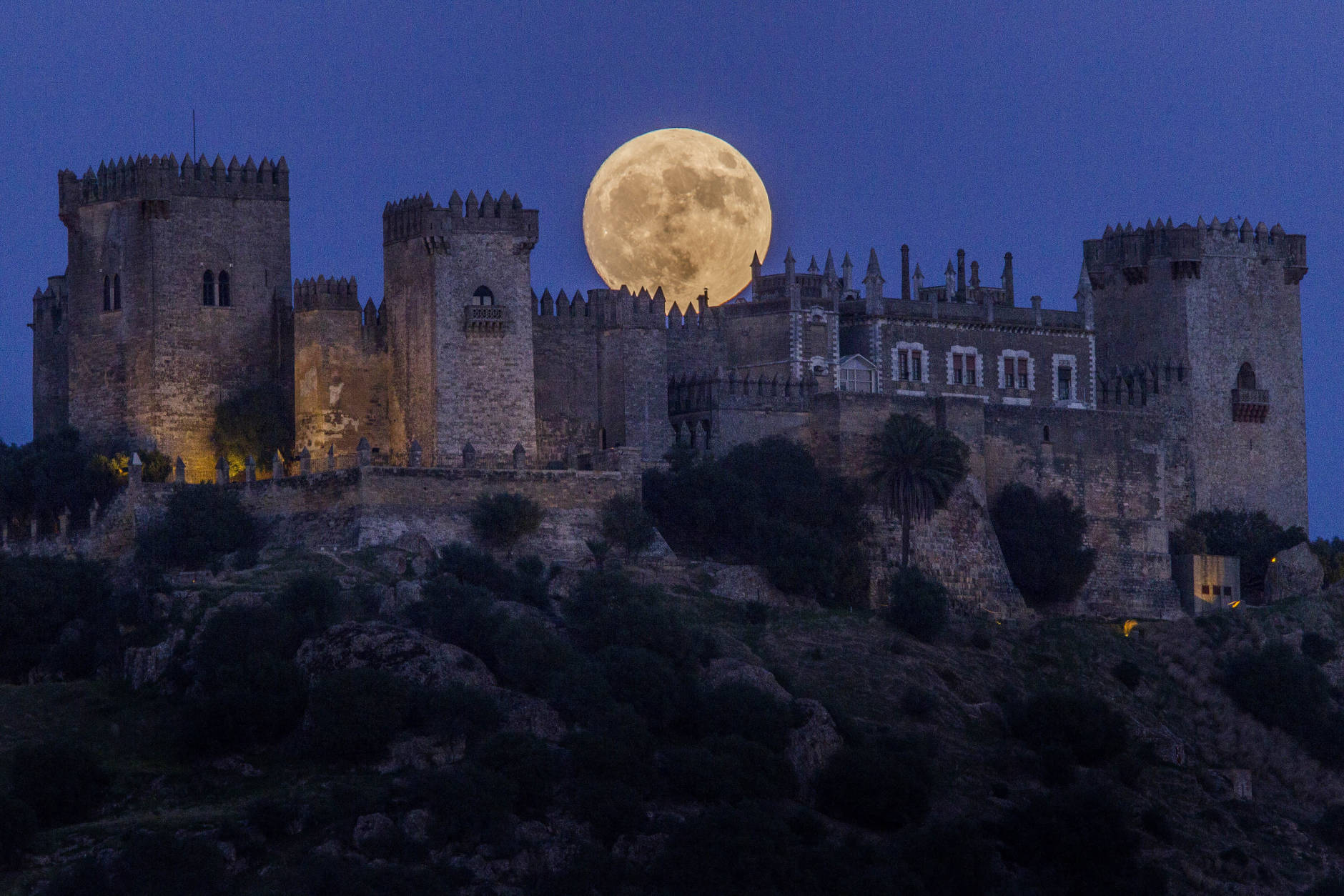 The moon rises behind the castle of Almodovar in Cordoba, southern Spain, on Sunday, Nov. 13, 2016. The Supermoon on November 14, 2016, will be the closest a full moon has been to Earth since January 26, 1948. (AP Photo/Miguel Morenatti)