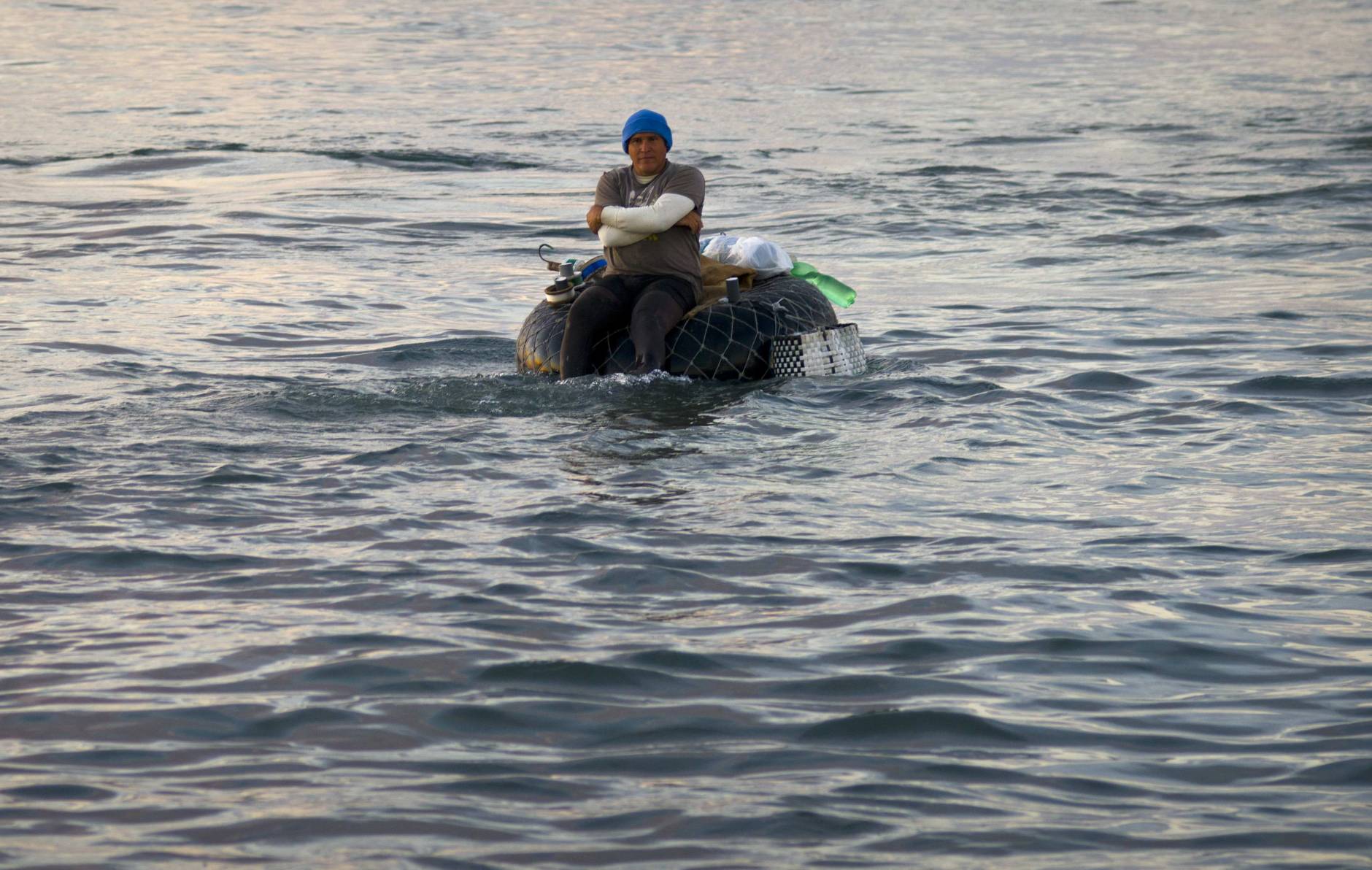 Inventive Cubans hunt expensive fish using inflated condoms