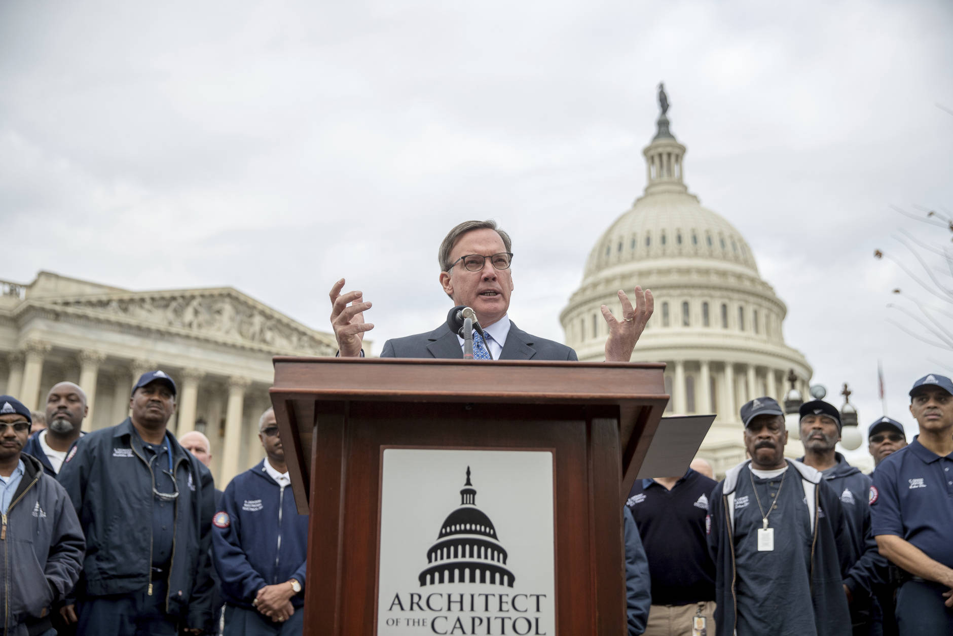Architect of the Capitol Stephen T. Ayers, center, accompanied by Architect of the Capitol staff, speaks at a news conference on Capitol Hill in Washington, Tuesday, Nov. 15, 2016, to announce the successful completion of the U.S. Capitol Dome Restoration Project. (AP Photo/Andrew Harnik)
