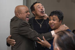 Gershwin Prize recipient Smokey Robinson sings with Berry Gordy Jr., founder of Motown Record Label and Library of Congress Librarian Carla Hayden, after conducting an interview at the Library of Congress in Washington, Tuesday, Nov. 15, 2016. (AP Photo/Molly Riley)