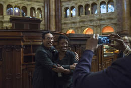 Gershwin Prize recipient Smokey Robinson poses with a fan inside the main reading room at the Library of Congress in Washington, Tuesday, Nov. 15, 2016. (AP Photo/Molly Riley)