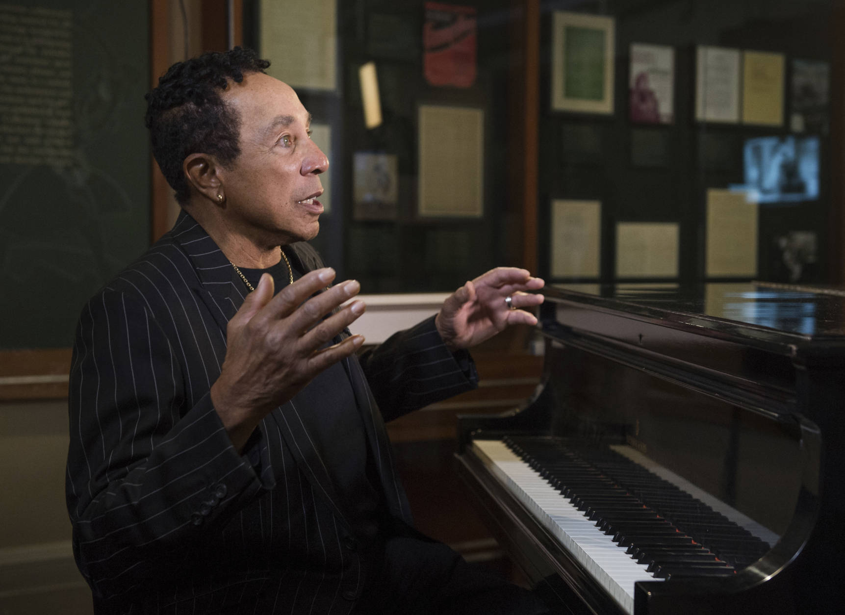 Gershwin Prize recipient Smokey Robinson sits at the favorite piano of George Gershwin in the Gershwin Room while visiting the Library of Congress in Washington, Tuesday, Nov. 15, 2016. (AP Photo/Molly Riley)