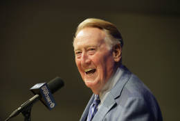 FILE - In this Sept. 24, 2016, file photo, Los Angeles Dodgers and Hall of Fame broadcaster Vin Scully smiles as he answers questions during a news conference at Dodger Stadium in Los Angeles. Scully will receive the Presidential Medal of Freedom on Tuesday at the White House. Scully is one of 21 recipients of the Medal of Freedom announced Wednesday, Nov. 16, 2016, including NBA Hall of Famers Kareem Abdul-Jabbar and Michael Jordan. (AP Photo/Jae C. Hong, File)