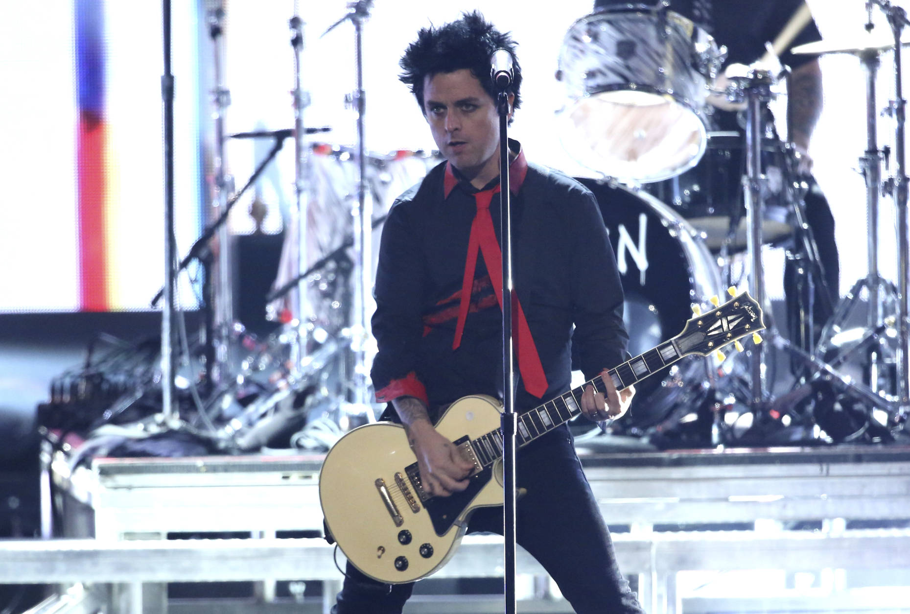Billie Joe Armstrong, of Green Day, performs "Bang Bang" at the American Music Awards at the Microsoft Theater on Sunday, Nov. 20, 2016, in Los Angeles. (Photo by Matt Sayles/Invision/AP)