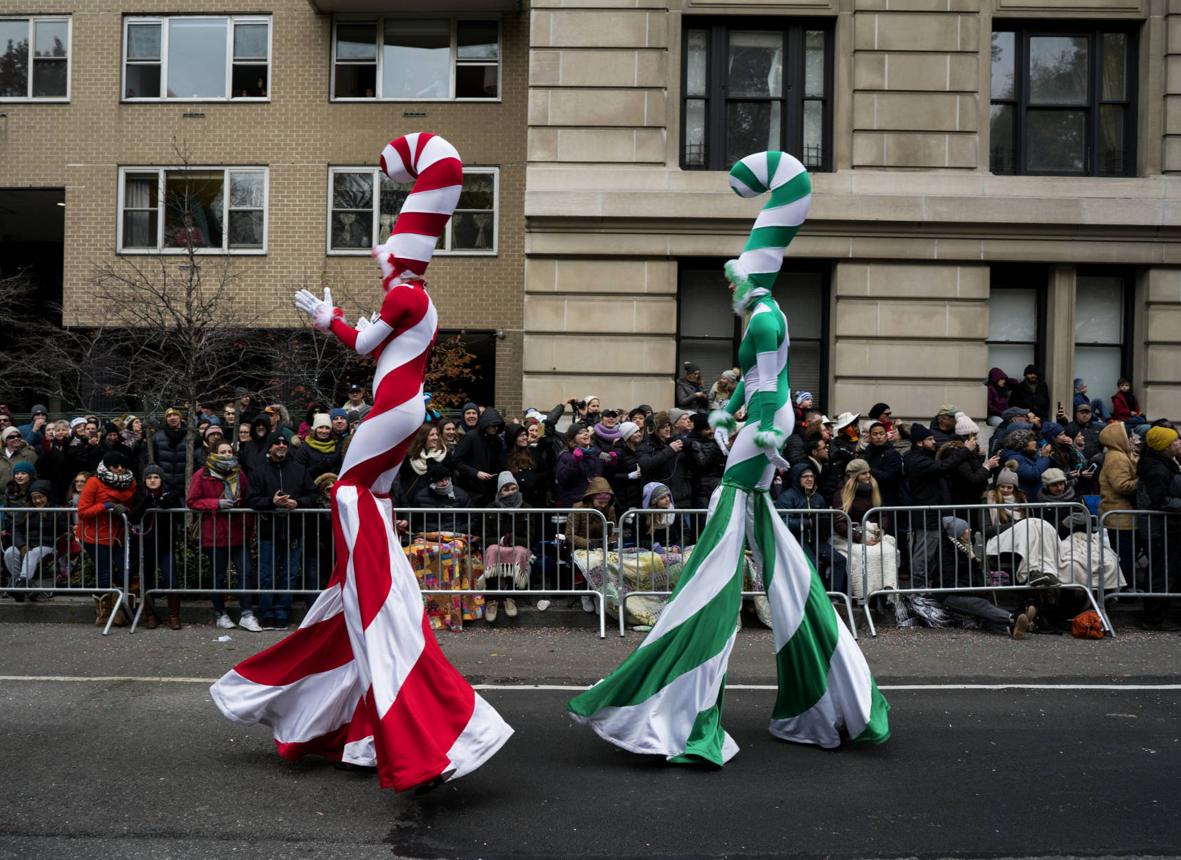 Participants stand tall above spectators along Central Park West during the Macy's Thanksgiving Day Parade in New York Thursday, Nov. 24, 2016. (AP Photo/Craig Ruttle)