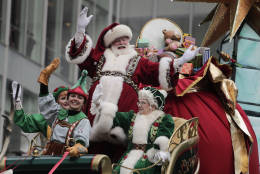 Santa Claus waves from his float as he passes along Sixth Avenue during the Macy's Thanksgiving Day parade, Thursday, Nov. 24, 2016, in New York. (AP Photo/Julie Jacobson)