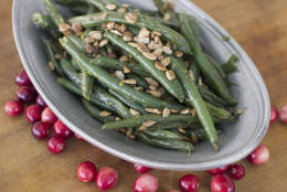 This Oct. 6, 2014 photo shows green beans with tarragon, mustard and sunflower seeds in Concord, N.H. The recipe is simple for skillet green beans bathed in brown butter, then tossed with fresh tarragon, Dijon mustard and lemon zest. (AP Photo/Matthew Mead)