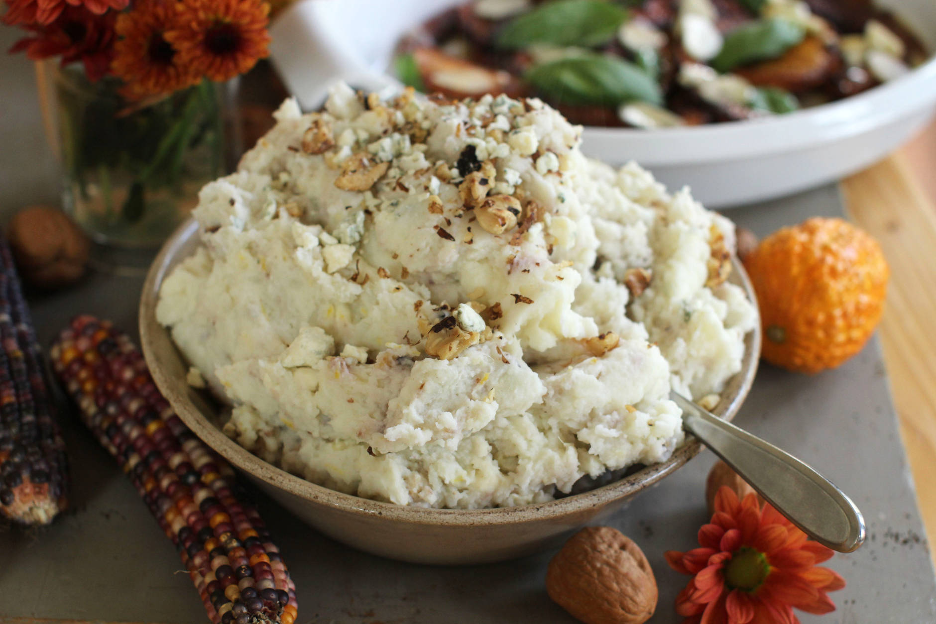 This Oct. 5, 2015 photo  shows blue walnut mashed potatoes in Concord, NH. We started by creating a master recipe for basic, buttery-creamy mashed potatoes that are delicious just as they are. (AP Photo/Matthew Mead)