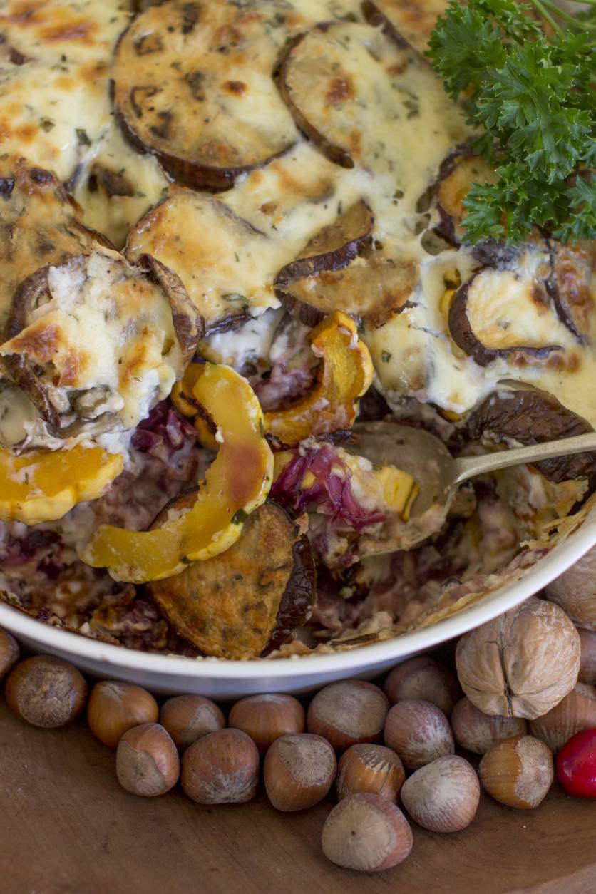 This Oct. 27, 2014 photo shows Thanksgiving eggplant strata in Concord, N.H. The deliciously creamy strata marries layers of roasted eggplant, delicata squash and red cabbage with a rich bechamel sauce. (AP Photo/Matthew Mead)