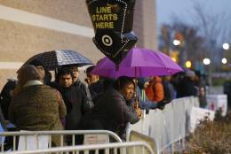 IMAGE DISTRIBUTED FOR TARGET - Guests wait for Black Friday sales before Target doors open at 6 p.m., Thursday, Nov. 24, 2016, in Jersey City, N.J. (Photo by Noah K. Murray/Invision for Target/AP Images)