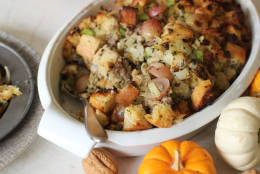 This Oct. 5, 2015, photo shows sausage and grape Thanksgiving stuffing in Concord, N.H. Making one giant batch of stuffing allows for some of it to be used to stuff the turkey, while the rest can be put into a well-buttered baking dish. (AP Photo/Matthew Mead)