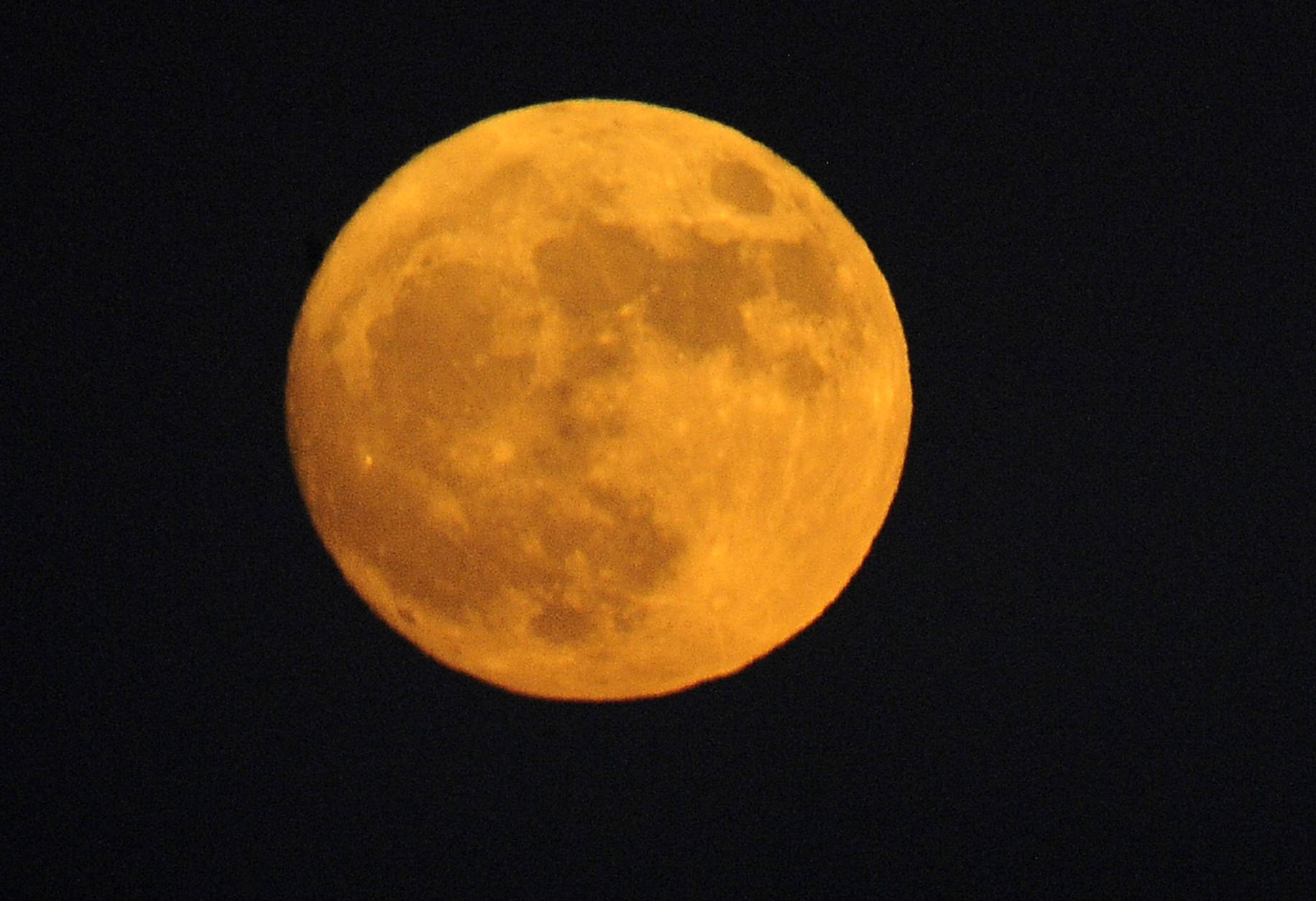 The moon rises over the San Gabriel Valley, as seen from Rosemead, Calif., Sunday, Nov. 13, 2016. Monday morning's supermoon will be the closet a full moon has been to the Earth since Jan. 26, 1948. (AP Photo/Nick Ut)