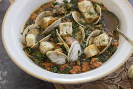 This Jan. 5, 2015 photo shows spicy clam and kale soup in Concord, N.H. Tucked away between the tofu cheeses and textured vegetable protein taco crumbles lies a good go-to and good-for-you ingredient, soy chorizo.  (AP Photo/Matthew Mead)