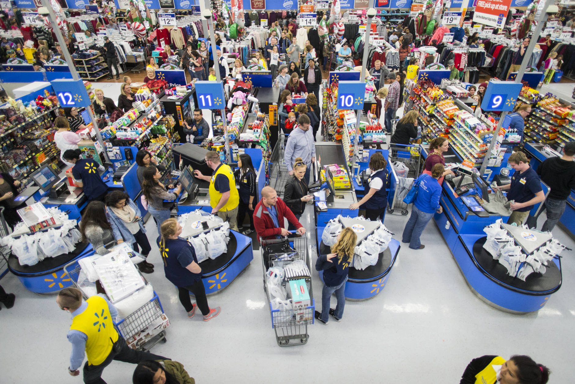 IMAGE DISTRIBUTED FOR WALMART - Customers leave happy from a Walmart store in Bentonville, AR, with their Black Friday items on Thursday, Nov. 24, 2016. This year, Walmart stocked its digital and physical aisles with more than 1.5 million televisions, nearly two million tablets and computers and three million video games. (Gunnar Rathbun/AP Images for Walmart)