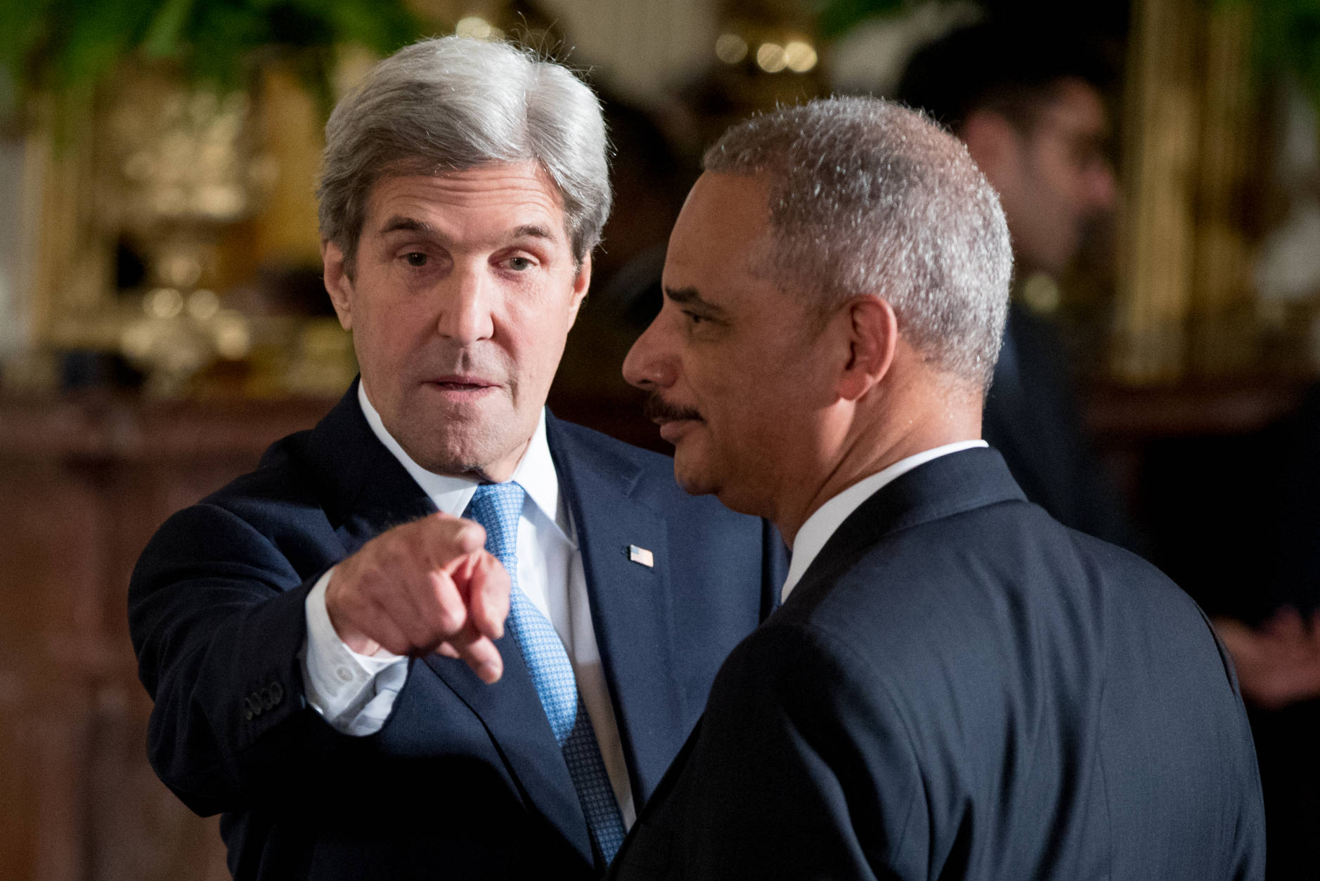 Secretary of State John Kerry, left, and former Attorney General Eric Holder, right, arrive for a Presidential Medal of Freedom ceremony in the East Room of the White House, Tuesday, Nov. 22, 2016, in Washington. Obama is recognizing 21 Americans with the nation's highest civilian award, including giants of the entertainment industry, sports legends, activists and innovators. (AP Photo/Andrew Harnik)