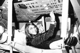 Margaret Hamilton of Cambridge, Mass., mathematic and computer programmer at the MIT Instrumentation Laboratory, sits in mock up of Apollo command module on display at the Cambridge school, Nov. 25, 1969 where she headed group that programmed Intrepids pinpoint landing in the Sea of Storms on the moon. (AP Photo)