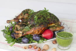 This Sept. 29, 2014, photo shows herb roasted Thanksgiving turkey in Concord, N.H. The inspiration for the turkey came from South American chimichurri, a richly herby sauce that pairs beautifully with roasted meats. (AP Photo/Matthew Mead)