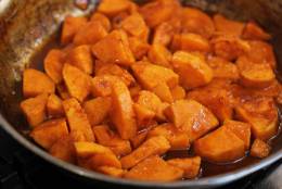 This Oct.  26, 2015 photo shows skillet glazed spicy sweet potatoes in Concord, NH.  No room in the oven, you can cook these delicious glazed sweet potatoes on top of the stove in about 10 minutes flat. (AP Photo/Matthew Mead)